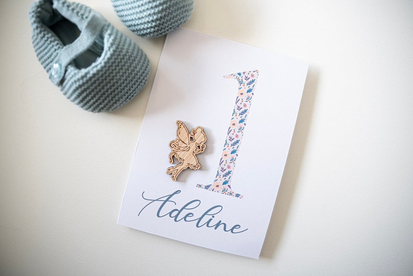 Celebrate a 1st birthday with our Personalized Card featuring a charming wooden charm. Perfect for a unique and heartfelt gesture.