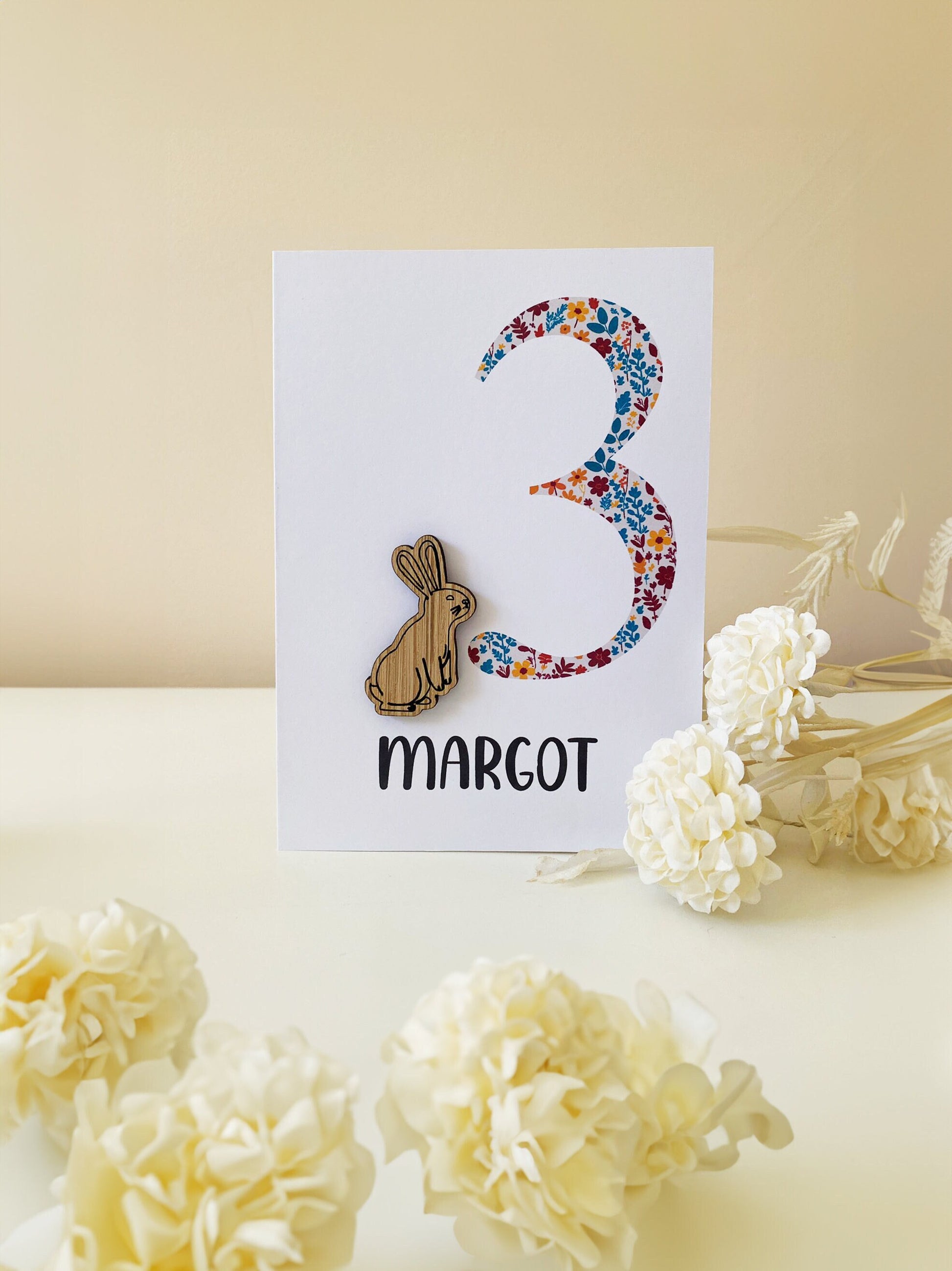 Celebrate a 1st birthday with our Personalized Card featuring a charming wooden charm. Perfect for a unique and heartfelt gesture.