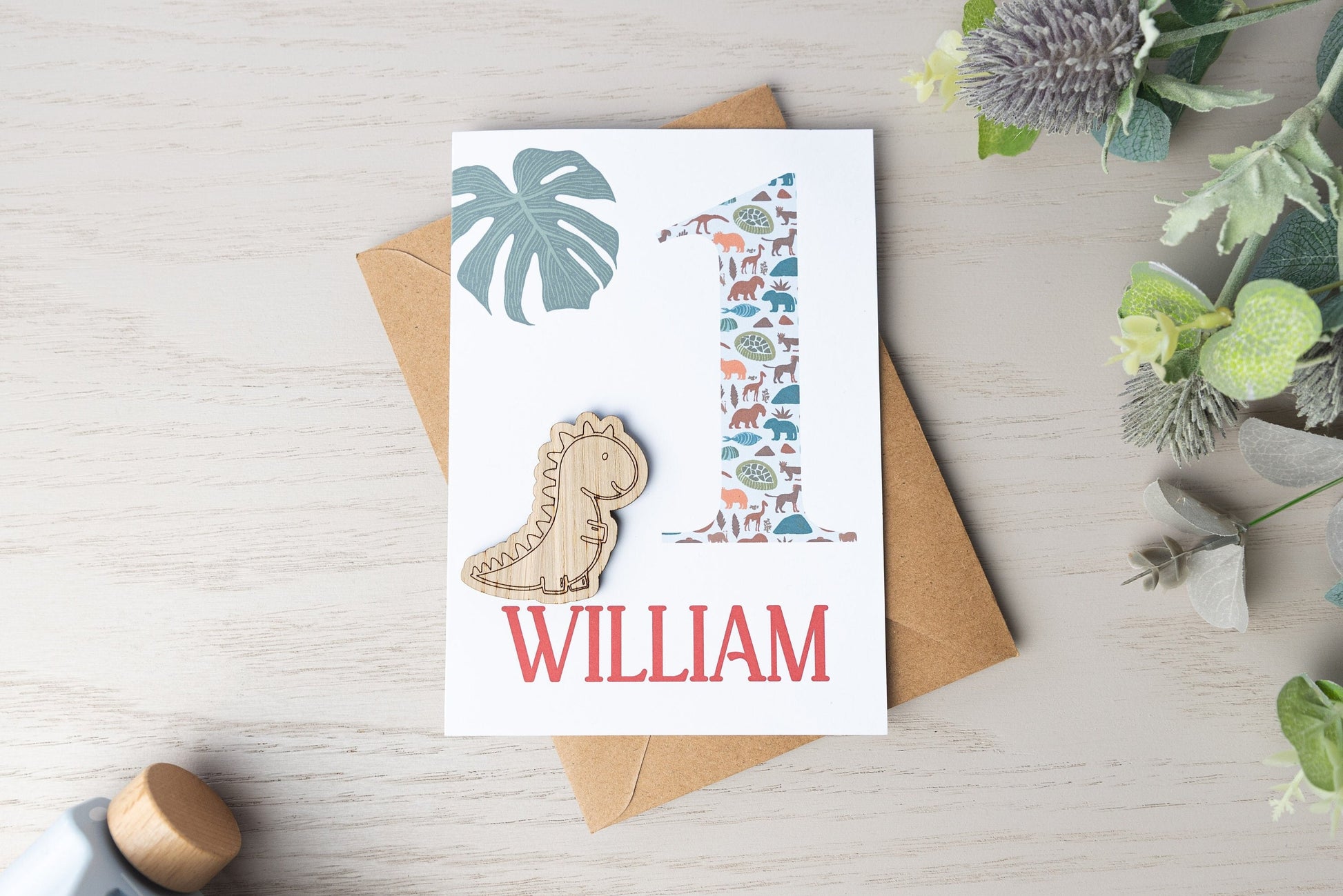 Celebrate a 1st birthday with our Personalized Card featuring a charming wooden charm. Perfect for a unique and heartfelt gesture.